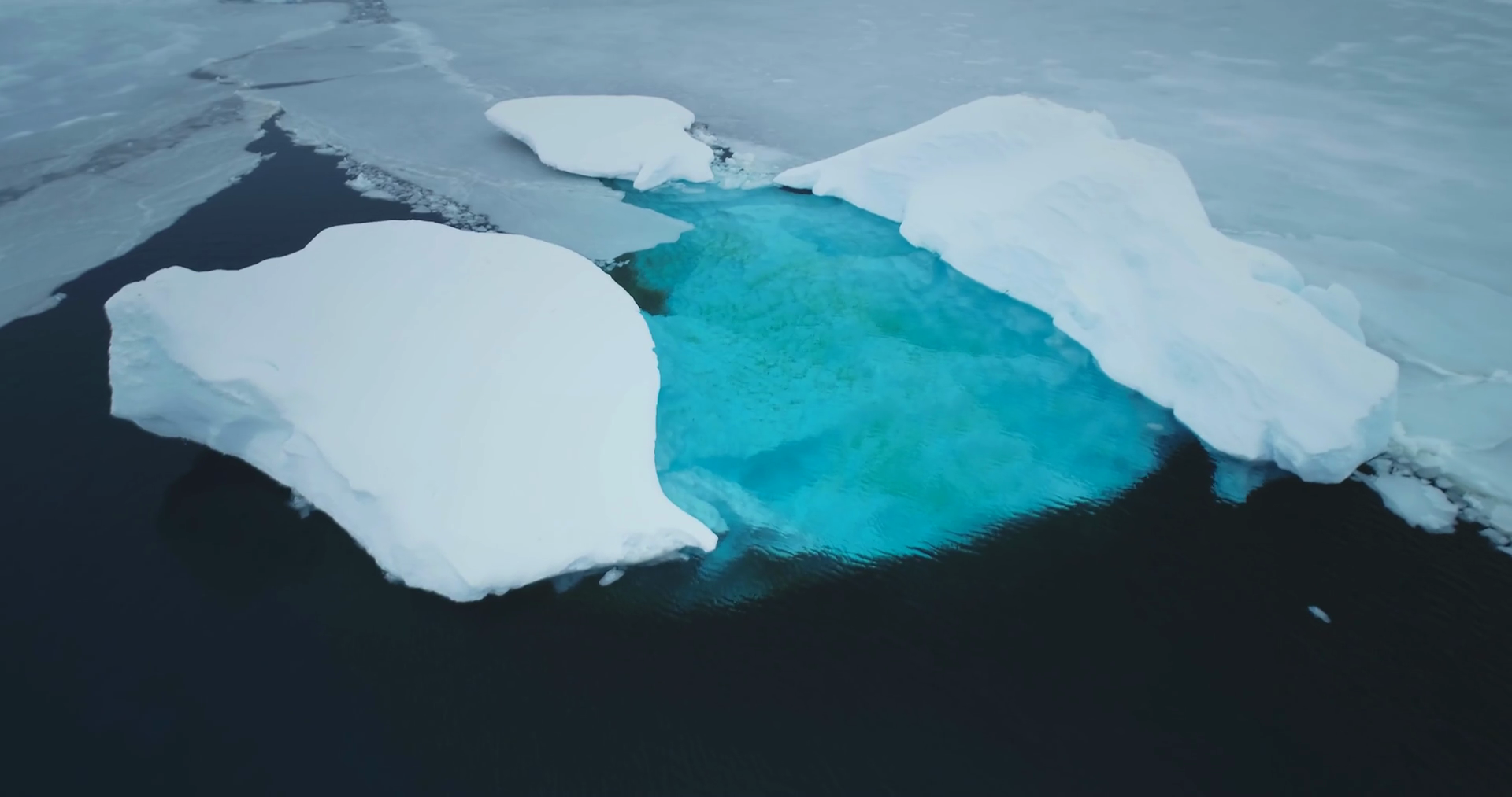 melting iceberg water pools blue color